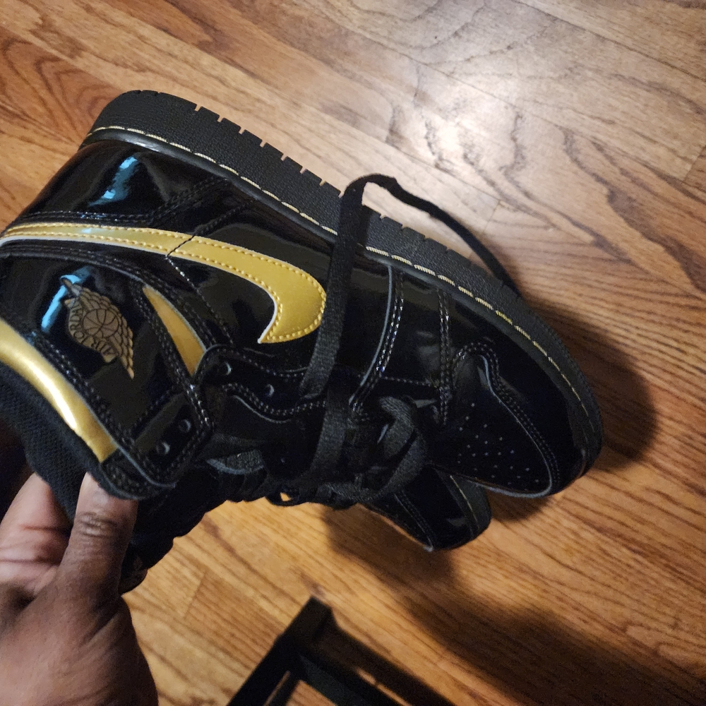 Jordan Black and Gold High-Top Sneakers